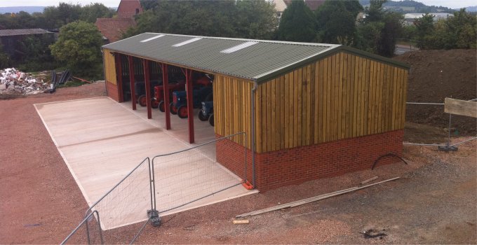 Mixed steel frame and wood walled farm building