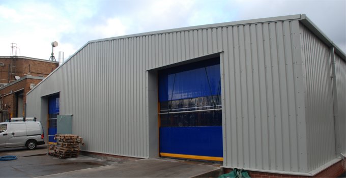 Steel building MOT workshop with roller doors