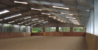 Riding area showing steel frame fnished with wood and sand top surface