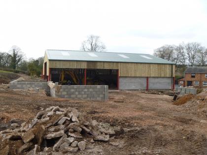Agricultural building from the side - notice the JCB in inside with full access