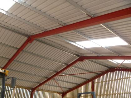 View from inside the barn showing the roofing structure