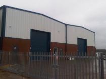 Steel-built workshop units on an industrial estate