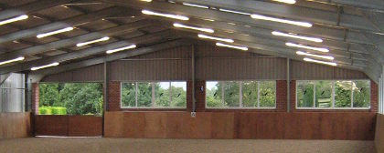 Covered riding arena with natural light and space